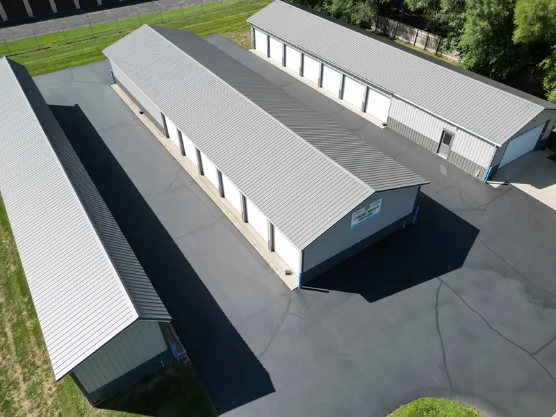 Overhead view of the paved drive aisles running between the storage buildings