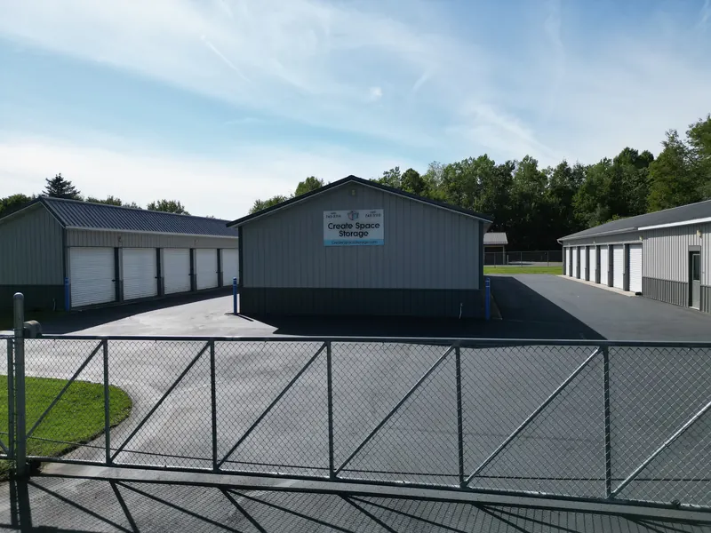 The Create Space Self Storage sign on the center building, seen from the entry gate